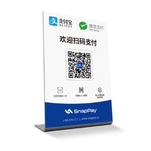 a small table signage that has alipay wechat pay and qr-code on it